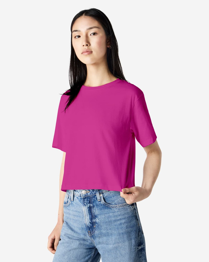 A women's fine jersey boxy t-shirt in vibrant pink, featuring short sleeves and relaxed fit. It has a logo.
