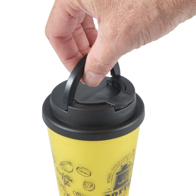 A yellow coffee mug with a black handle lid, featuring a hand gripping the lid.