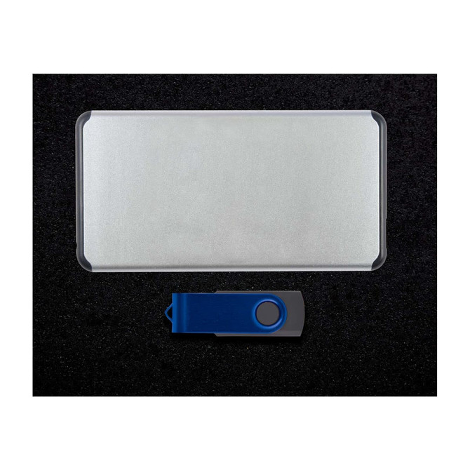A silver power bank and a blue USB flash drive arranged on a dark surface, featuring a logo on the flash drive.