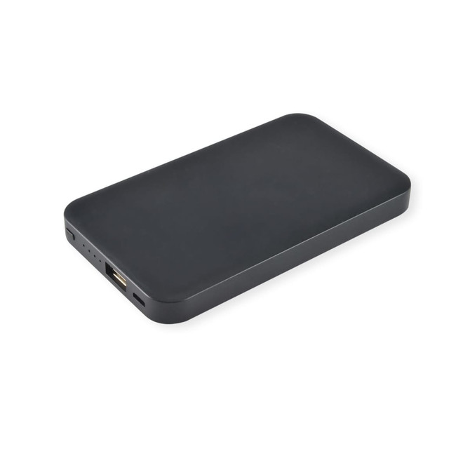 A black wireless power bank with a slim design and an integrated USB port. It features a discrete logo.