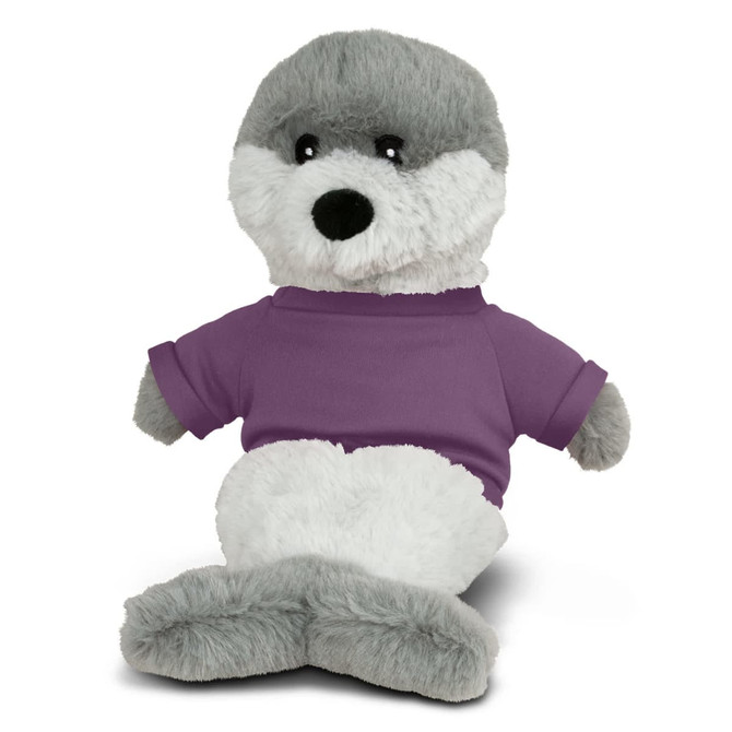 A grey and white seal plush toy wearing a purple T-shirt, sitting upright with large black eyes.