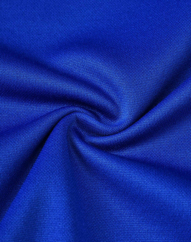 A close-up of vibrant blue fabric showcasing a smooth texture, indicative of a sustainable poly/cotton blend.