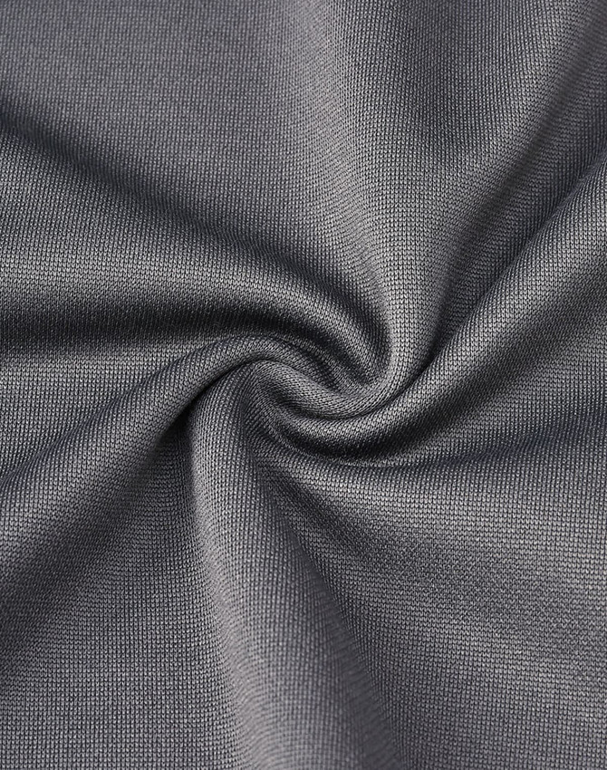 A close-up of grey sustainable poly/cotton fabric, showcasing a smooth and soft texture with a swirl design.