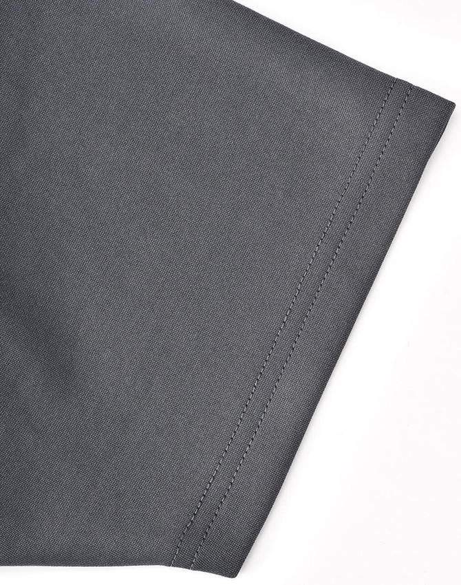 A grey polo shirt sleeve featuring contrasting stitching and a logo. Sustainable poly/cotton fabric.