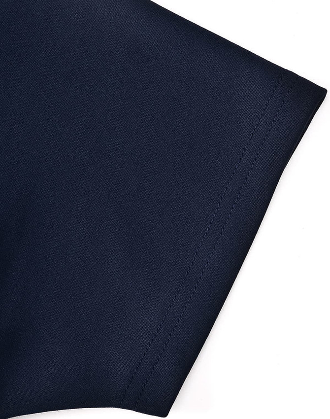 A close-up of a navy poly/cotton polo shirt showcasing the sleeve detail and stitching. The shirt features a logo.