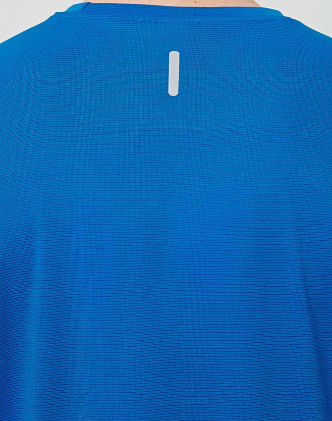 A blue men's lightweight performance short-sleeve tee featuring a reflective detail on the back and a logo.