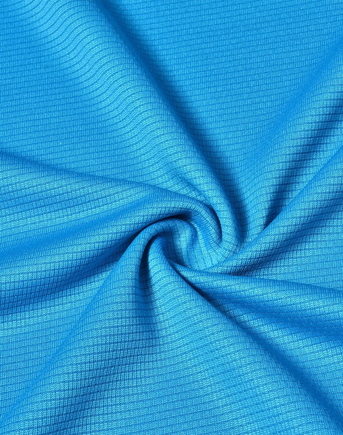 A close-up of a textured fabric in a vibrant blue colour, featuring a grid pattern. The material is lightweight and performance-oriented.