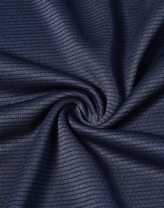 A close-up of navy textured fabric, showcasing a lightweight material with a subtle grid pattern.