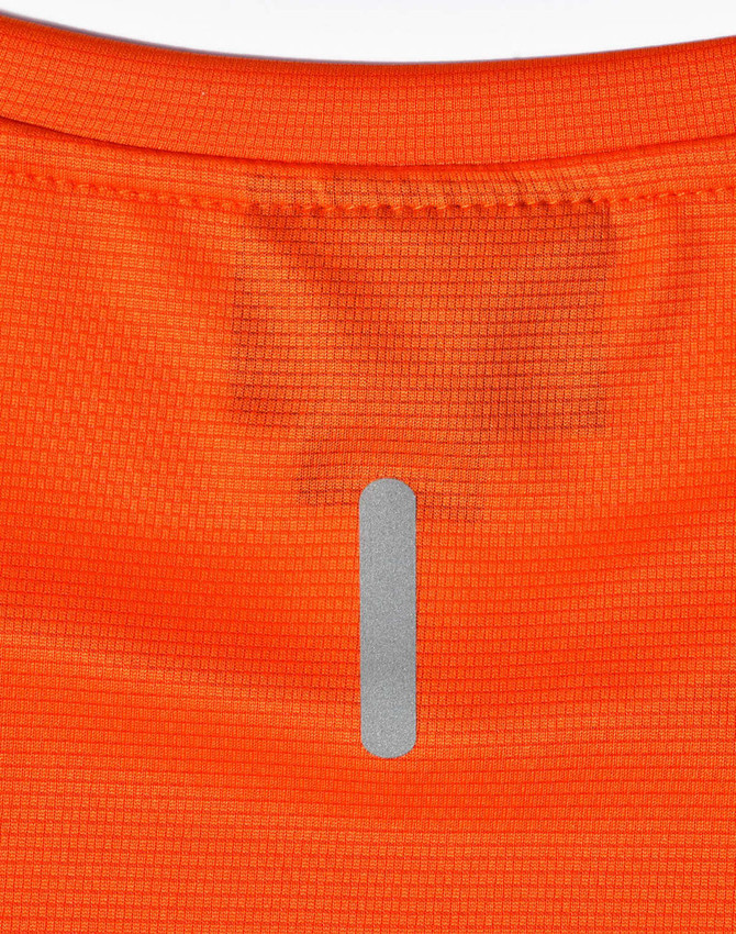 An orange lightweight performance t-shirt featuring a reflective logo on the back.