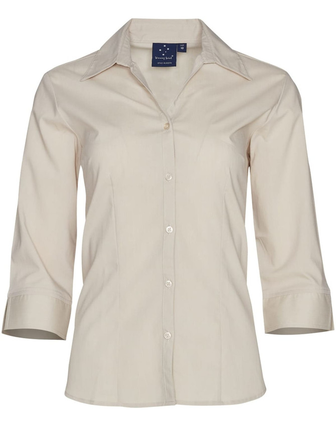 A beige women's button-up shirt with 3/4 sleeves and a collar, featuring a logo on the tag.