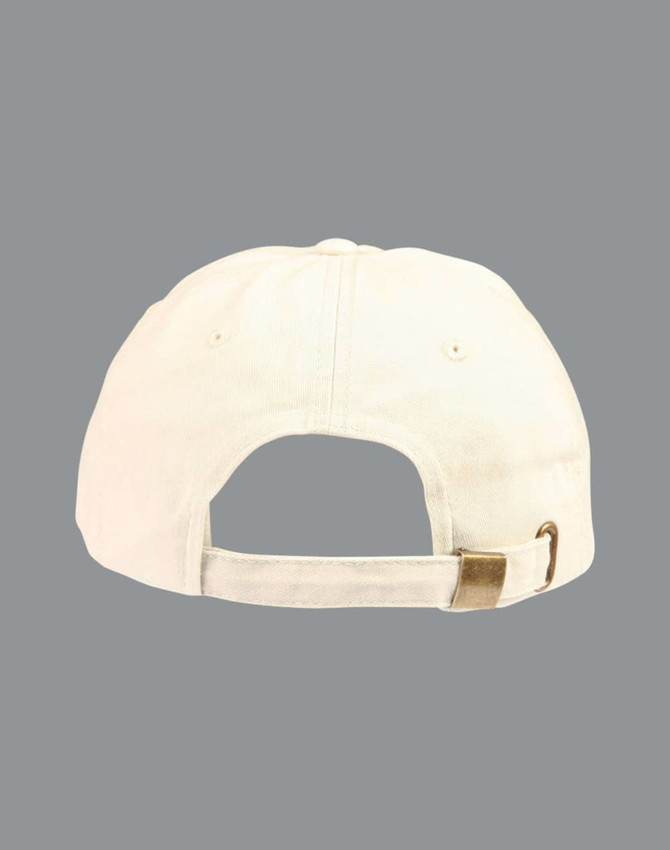 A washed polo sandwich cap in cream colour featuring an adjustable strap at the back and a logo.