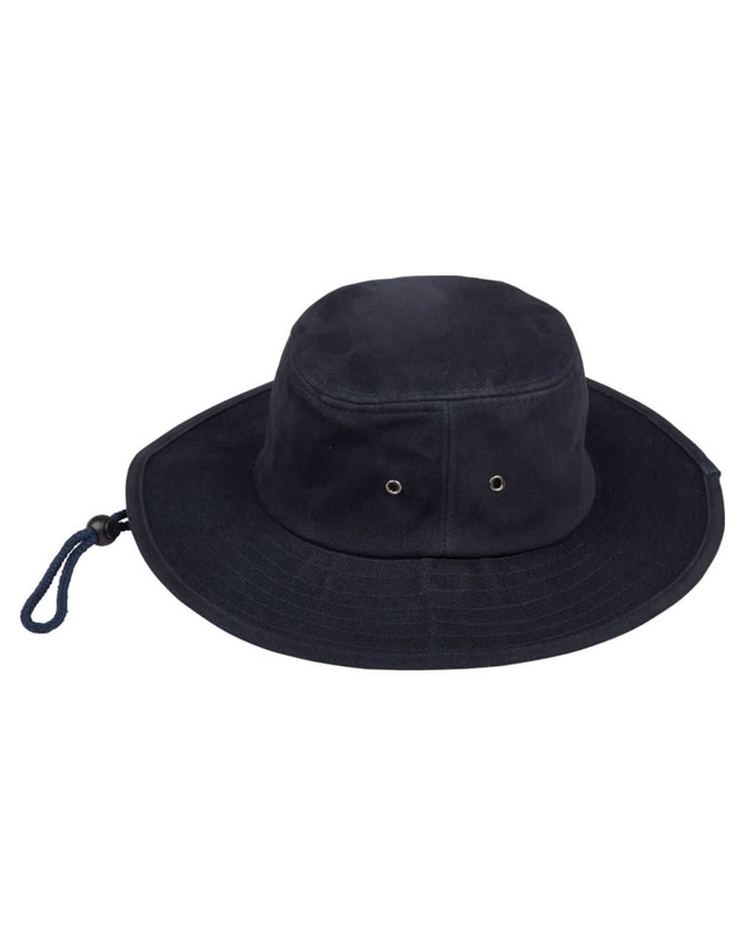 A navy blue bucket hat featuring ventilation eyelets and a drawstring. It has a logo on the side.