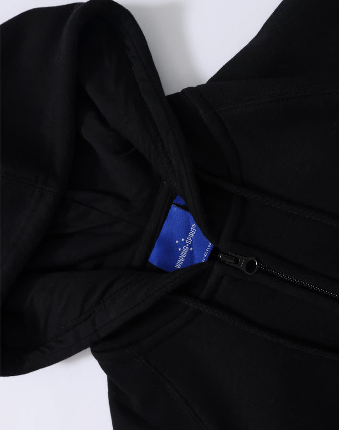 A black ladies' full-zip fleecy hoodie featuring a hood and a zipped front, with an inner label visible.