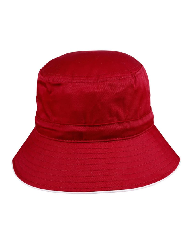 A red bucket hat with a wide brim, featuring a toggle and a logo.