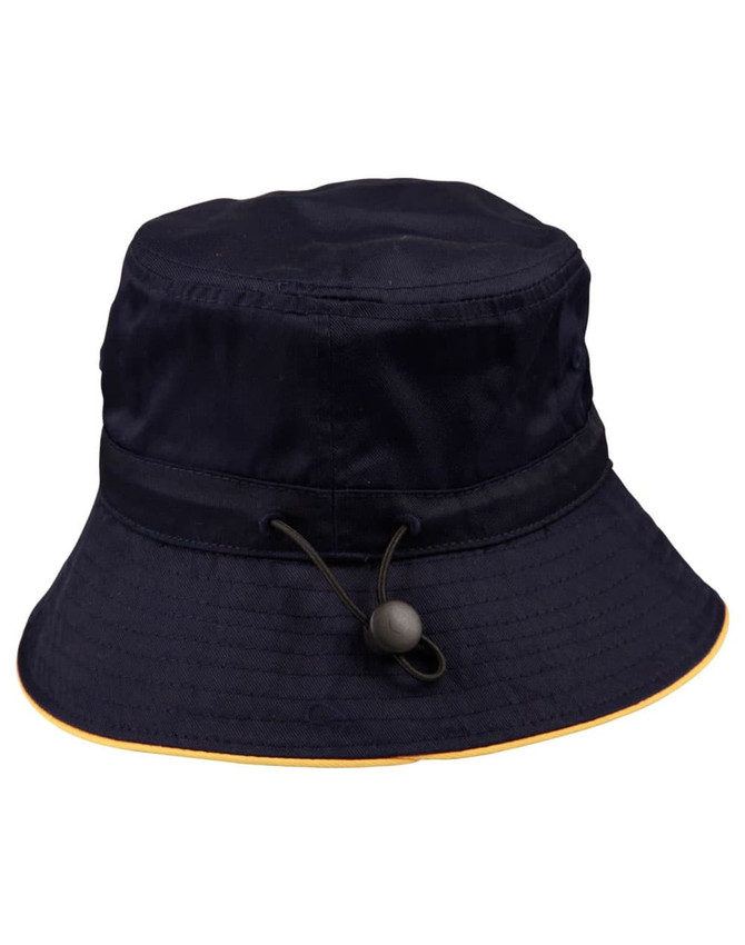 A navy bucket hat with a toggle adjustment, featuring a yellow rim and a logo on the side.