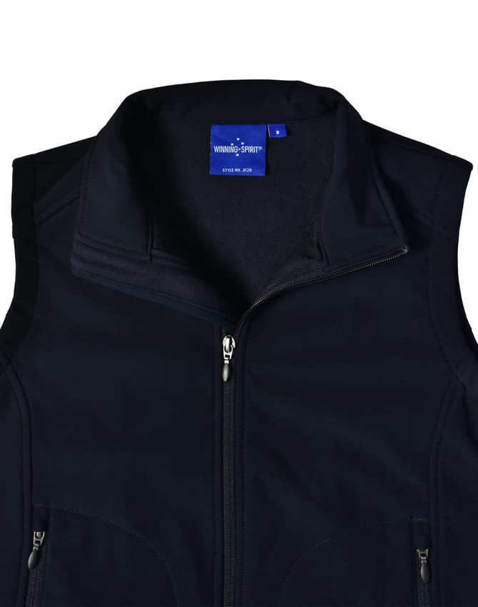 A black, softshell vest featuring a zippered front and a collar. It has a branding label inside.