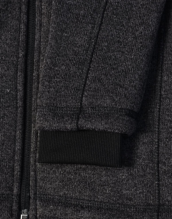 A dark heather grey fleece jacket with a black ribbed cuff and zipper detail. It also features a logo.