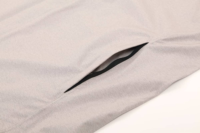 A light grey men's waterproof performance jacket featuring a side pocket, designed for rain protection.
