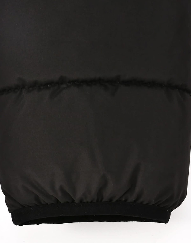 A black men's sustainable insulated puffer jacket featuring a 3D cut with a soft cuff at the hem.