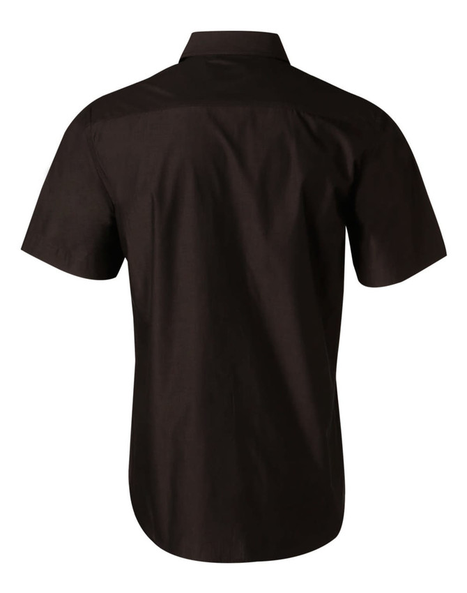 A short sleeve button-up shirt in black, featuring a back yoke and a logo on the fabric.