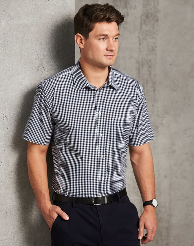 A men's short-sleeve button-up shirt in black and white gingham check, featuring a collar and a logo.