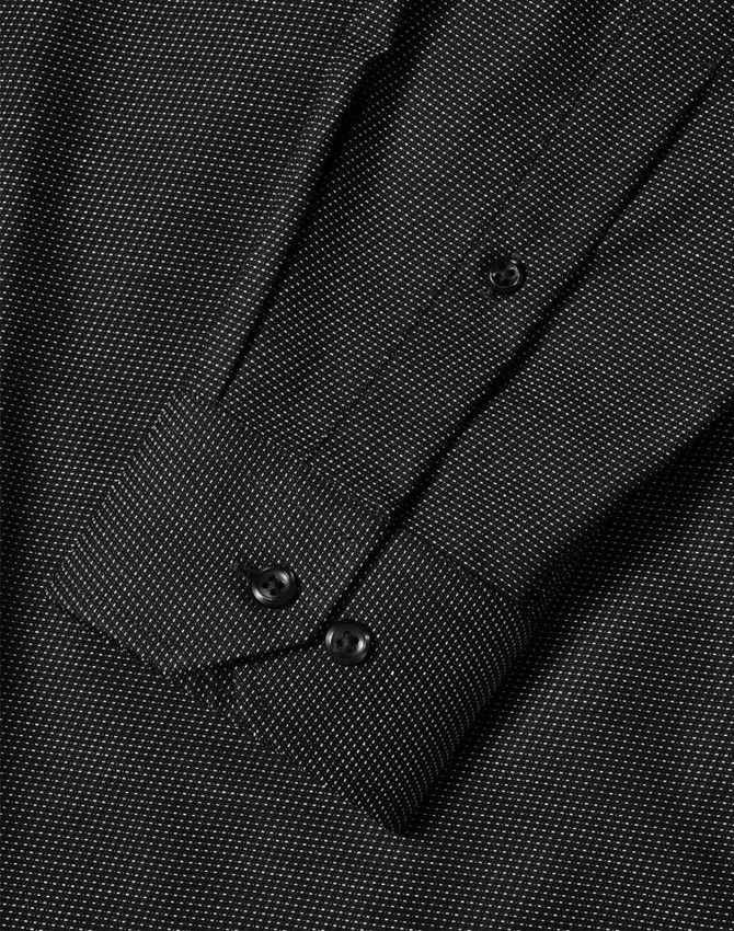 A black pin dot long-sleeve button-up shirt with a detailed collar and cuff design.
