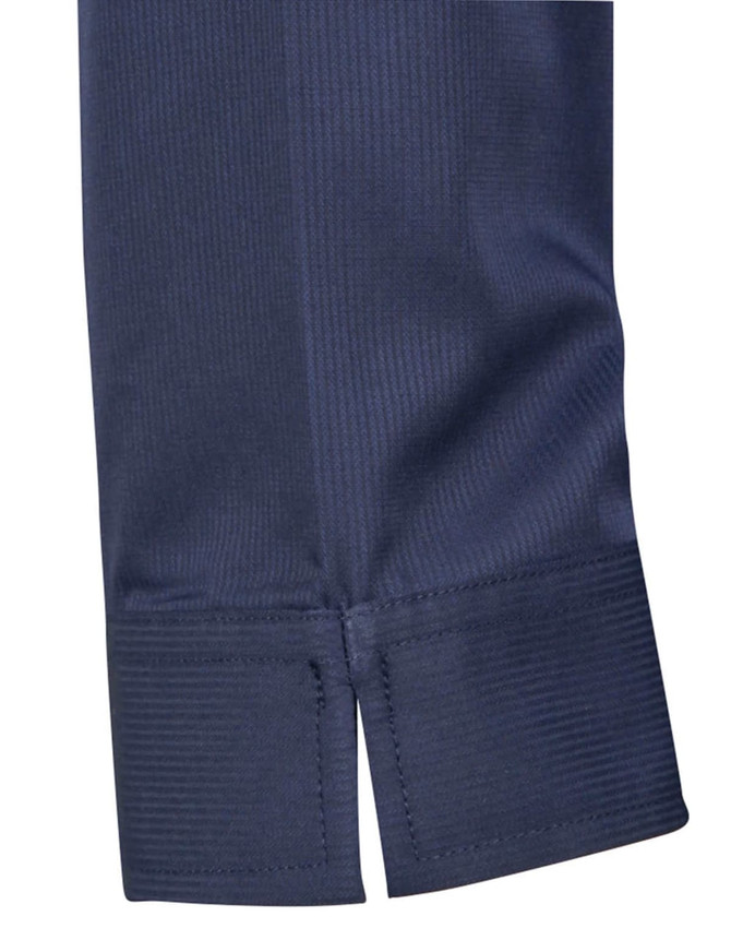 A close-up of a navy blue shirt sleeve with a subtle striped pattern and a taped hem detail.