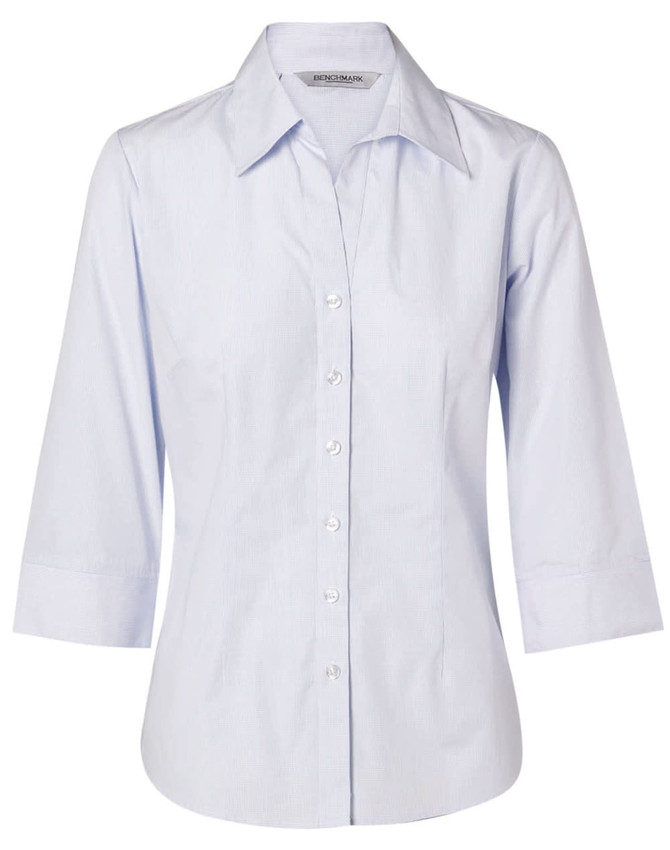 A light blue women's button-up shirt with 3/4 sleeves, featuring a collar and a logo.