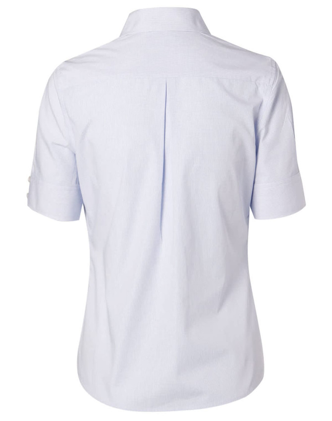 A light blue women's button-up shirt featuring short sleeves and a back pleat, with a logo on the label.