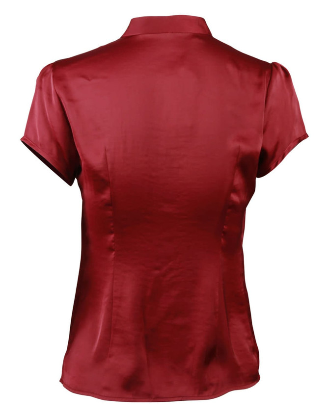 A women's tie neck blouse in a rich maroon colour with short sleeves and a smooth satin finish.