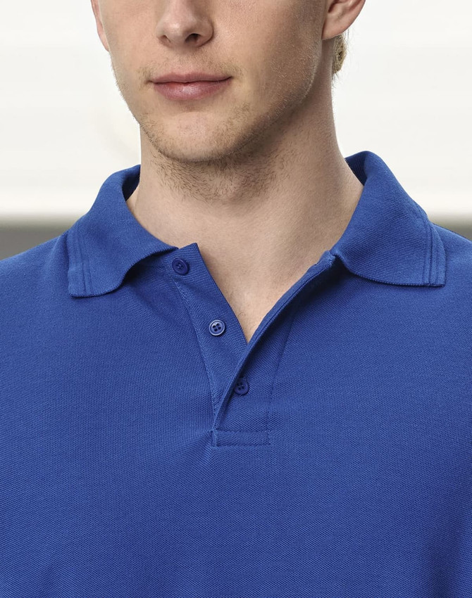 A close-up of a blue unisex long sleeve polo shirt with a classic collar and a logo on the chest.