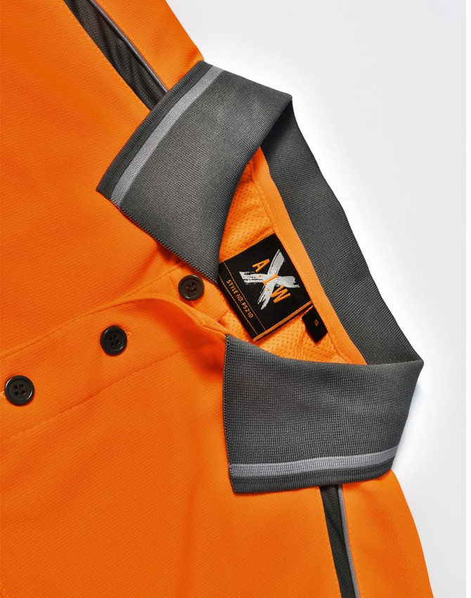 An orange polo shirt with grey accents and a logo at the collar, featuring buttons down the front.
