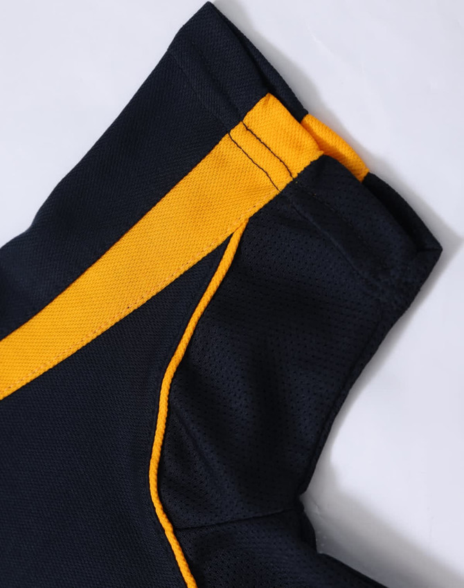 A close-up of a navy blue polo shirt with yellow detailing on the collar and sleeves, featuring a branding logo.