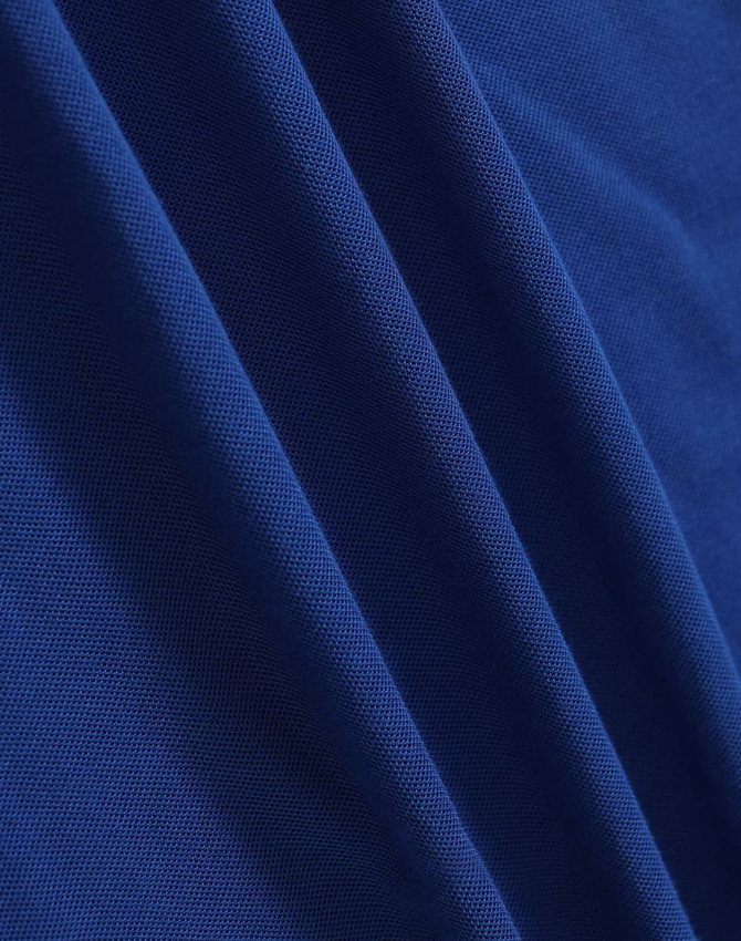 A close-up of deep blue fabric, showcasing a smooth texture with subtle woven patterns.
