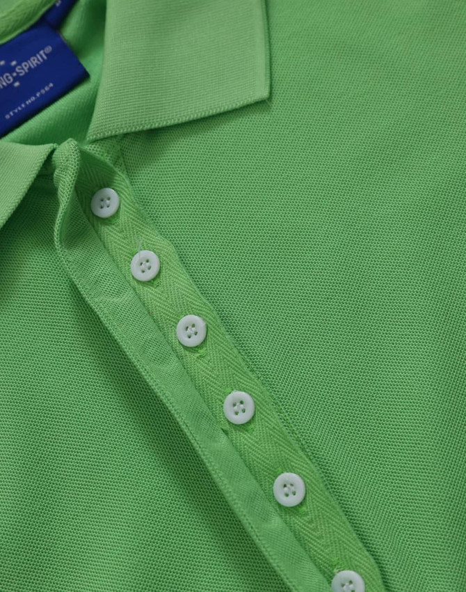 A green polo shirt featuring a classic collar and button placket, with a logo on the label.