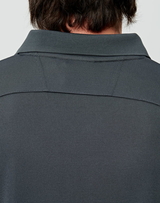 A dark grey men's bamboo charcoal long-sleeve polo shirt, focusing on the back collar and textured fabric.