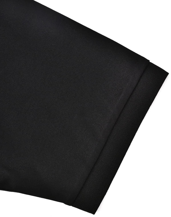 A close-up of a black sustainable poly/cotton polo shirt sleeve featuring a plain finish and a cuff.