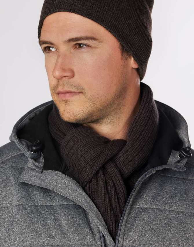 A man wearing a dark brown cable knit scarf, paired with a grey jacket and matching beanie.
