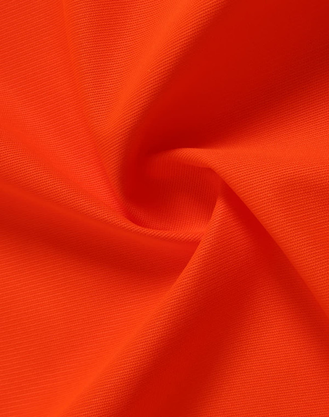 An orange fabric with a smooth texture, ideal for safety wear, featuring a logo in the corner.
