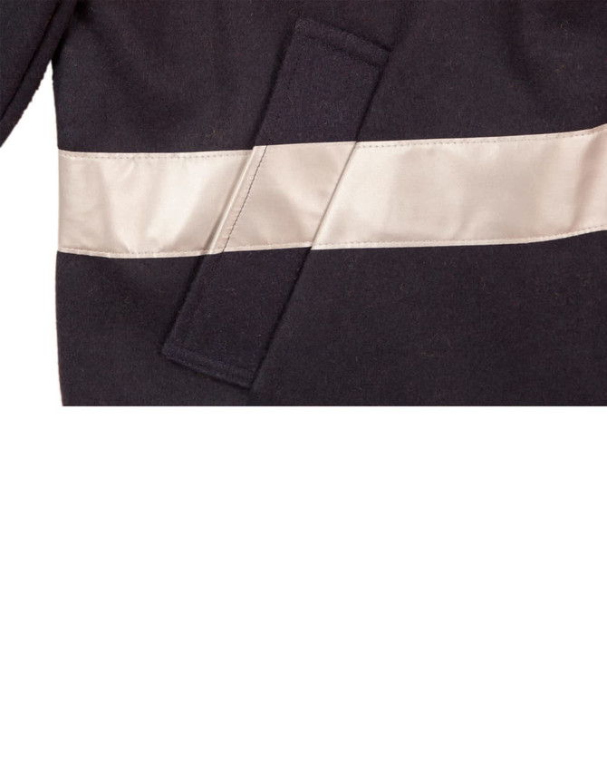 A blue safety jacket featuring reflective 3M tape, designed for visibility in work environments.