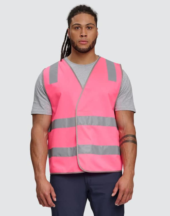 A bright pink safety vest with reflective shoulder tapes, featuring a plain design and worn by a male model.