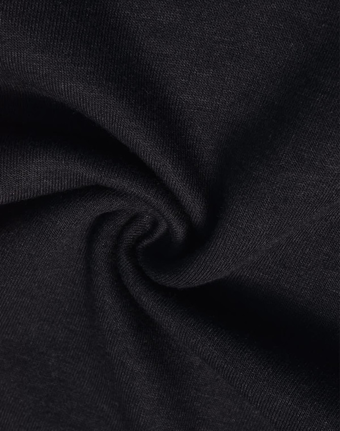 A close-up of black poly/cotton terry fabric, displaying a soft, textured surface.