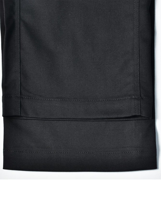 A pair of black utility stretch cargo work pants featuring a cuffed hem and visible stitching details.