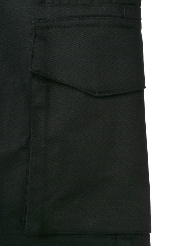 A close-up of black cotton stretch ripstop work shorts featuring a side pocket and durable fabric texture.