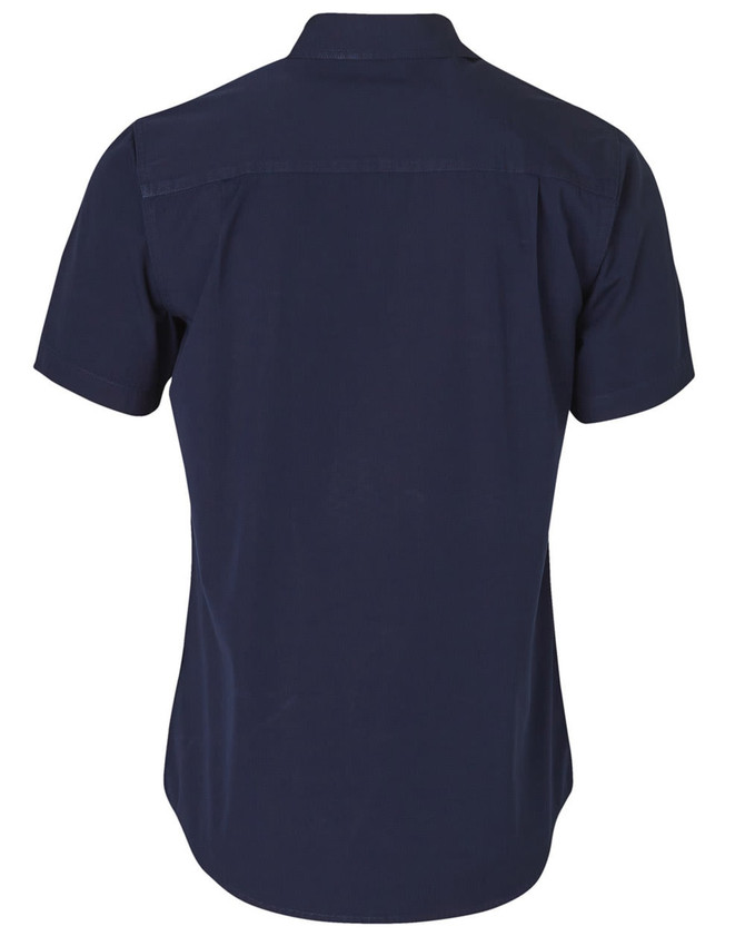 A navy blue short sleeve work shirt featuring a collar and a back yoke, with a branding logo on the label.