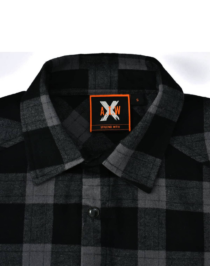 A black and grey flannel plaid shirt with a button-up collar and a branded label.