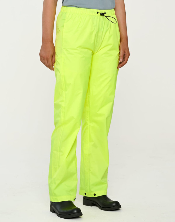 Lightweight nylon waterproof rain pants in bright yellow, featuring an elastic waistband and a casual fit.