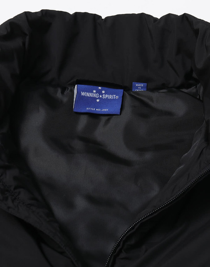 A black insulated puffer vest featuring a smooth inner lining and a logo tag inside the collar.