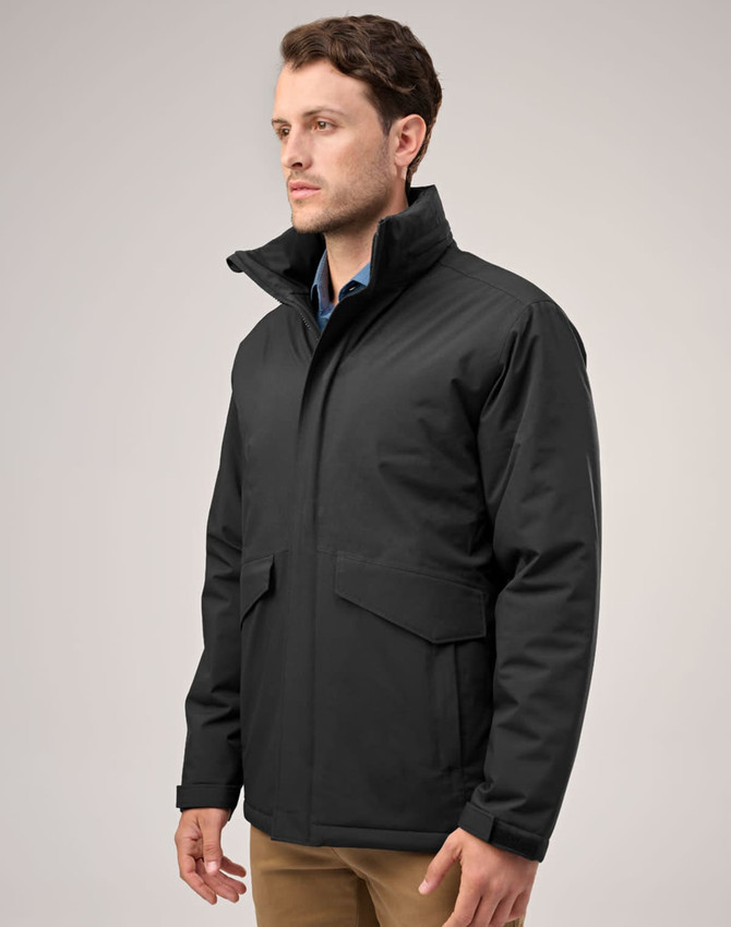 A black unisex quilted waterproof jacket with a high collar and side pockets displayed on a model.