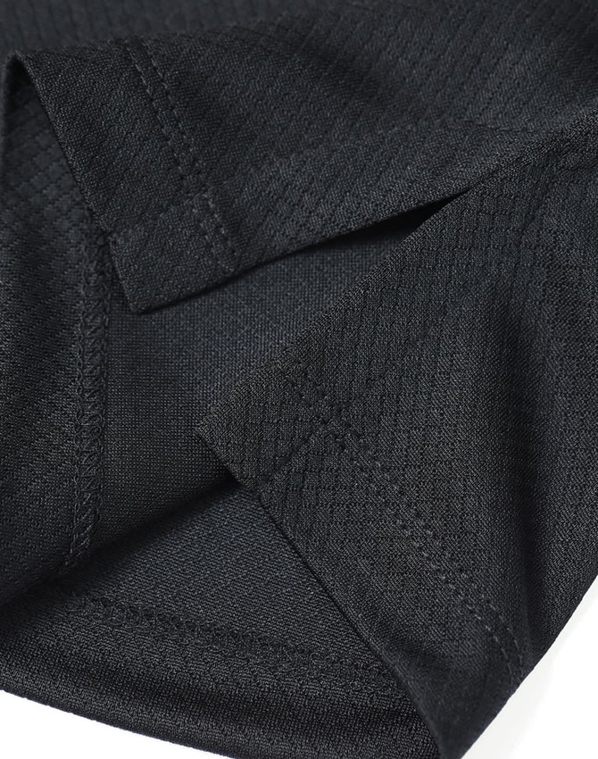 A close-up of a black Jacquard knit fabric showing sleeve details and stitching. It features a logo.